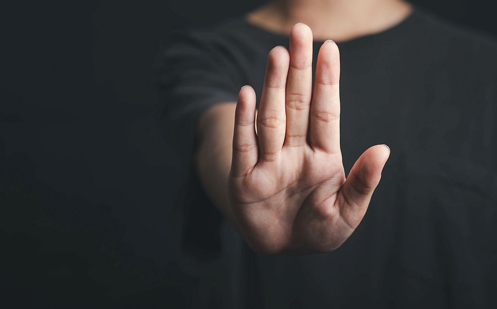 Human hand show stop sign, Hold arm one person stop gesture in d
