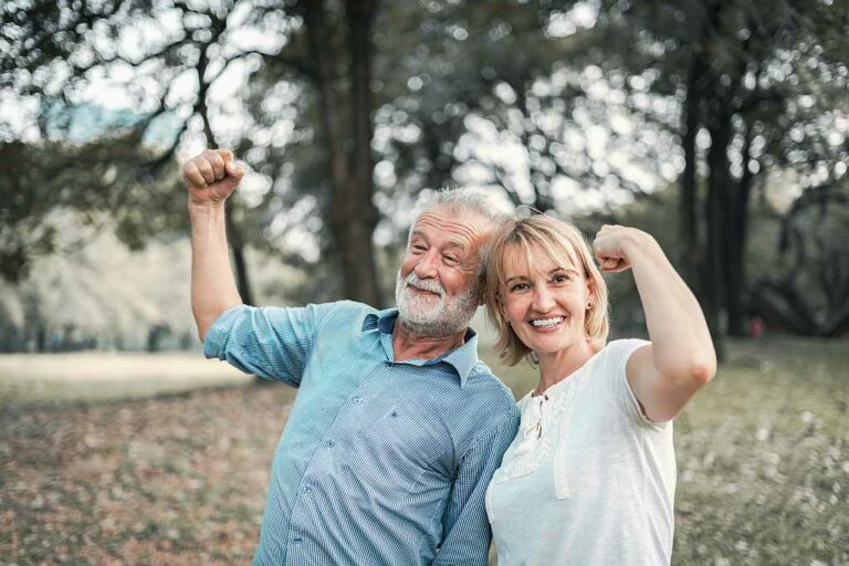 Happy elderly senior couple in park with good health action concept, Foto: Adobe Stock