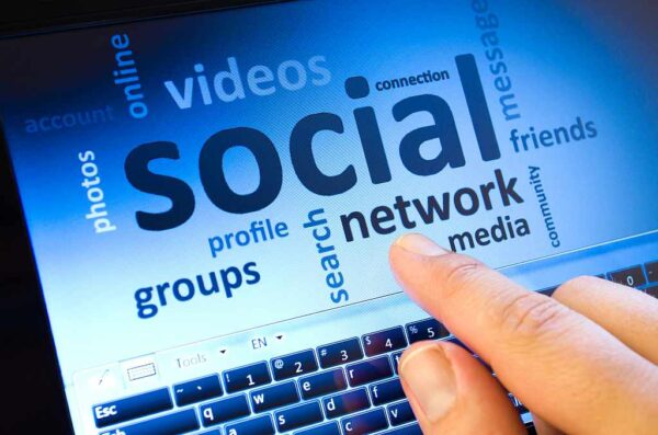 social network and connected words on touch-screen tablet-pc with finger touching screen